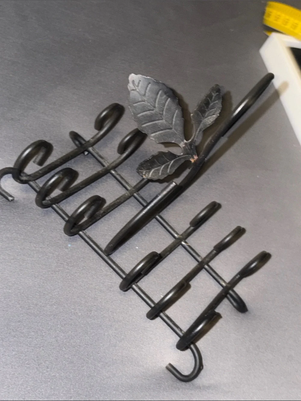 Black Metal ring holder Rack with Decorative Leaf Accent